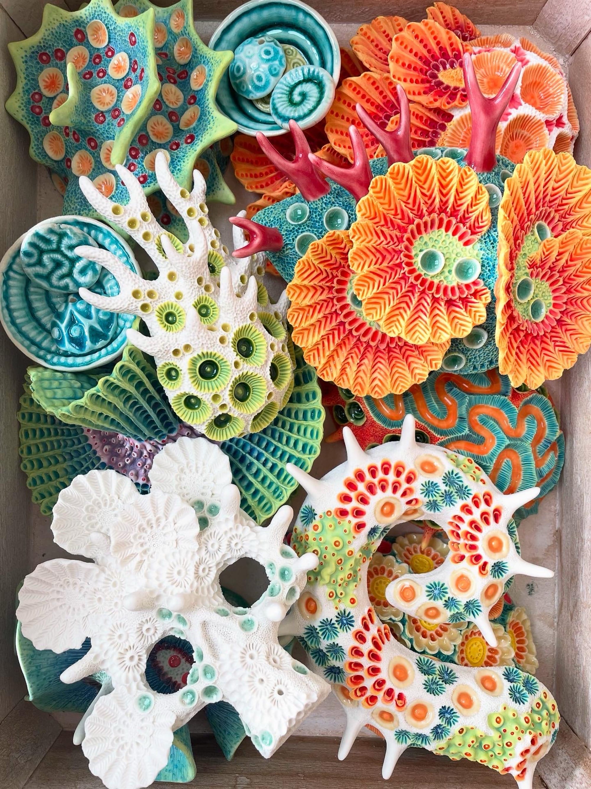 a selection of coral-inspired, colorful ceramic sculptures by Lisa Stevens