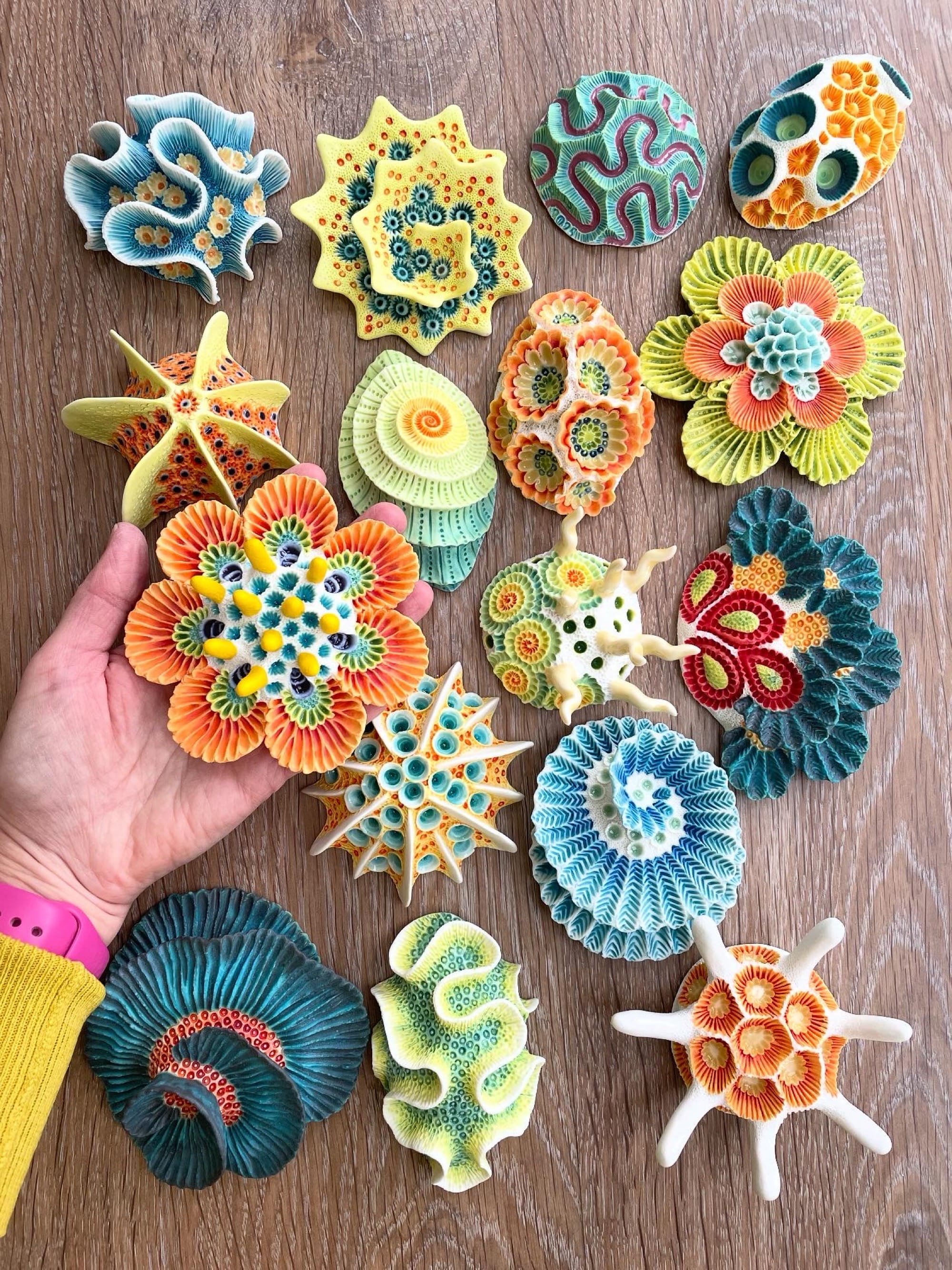 a selection of coral-inspired, colorful ceramic sculptures by Lisa Stevens