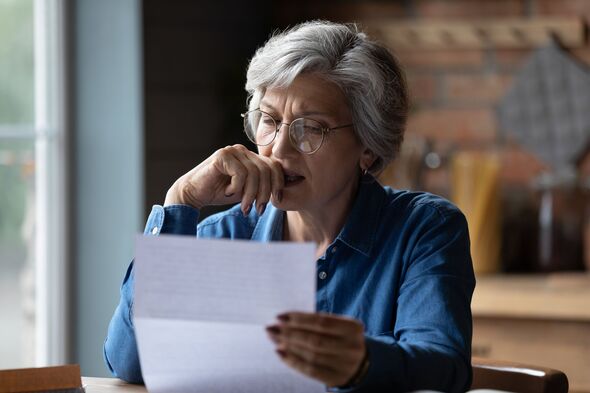 Stressed older latin woman get bad surprise reading official letter Stressed older latin woman get bad surprise reading official letter