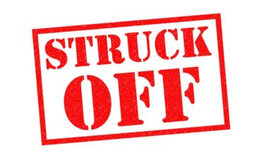 A red stamp with the words 'struck off'