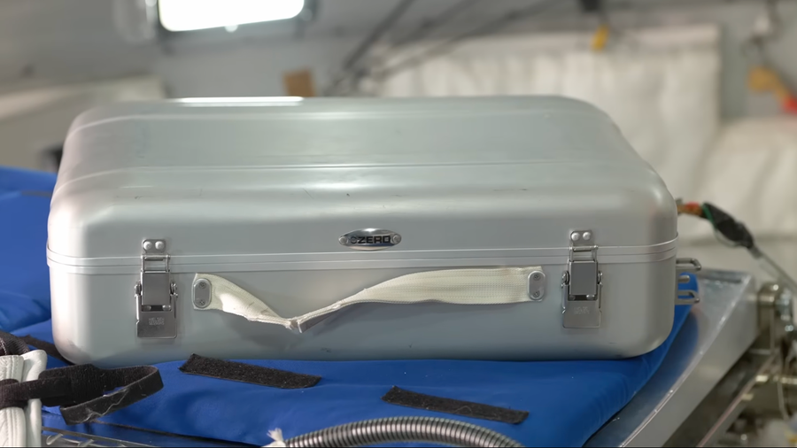 A silver box with a handle