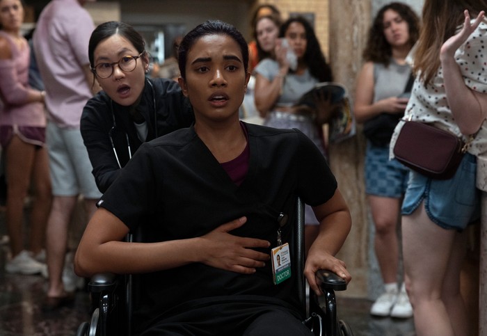Supriya Ganesh in a wheelchair in a scene from The Pitt season 2.