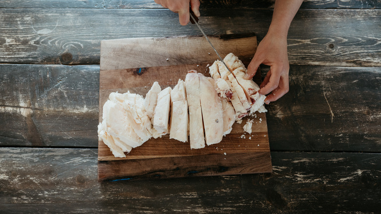 Cutting tallow on a chopping board
