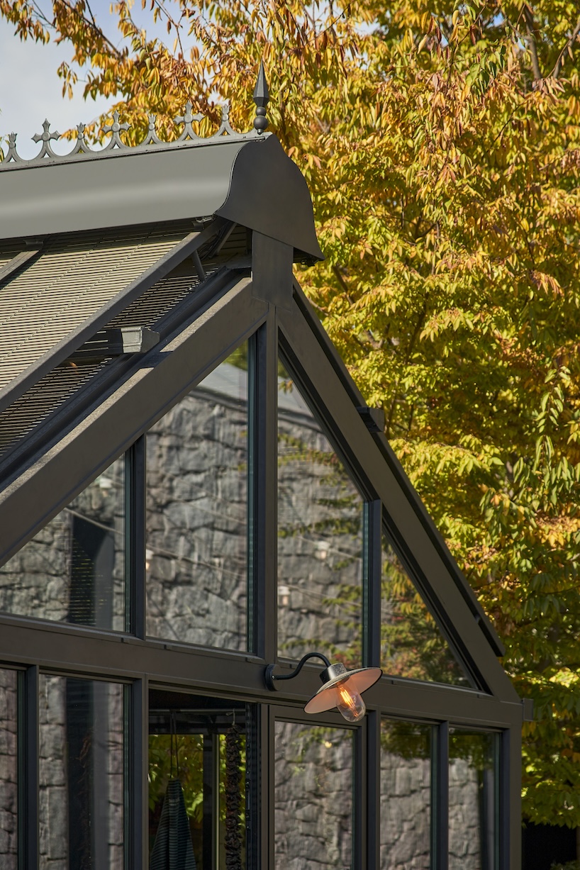 aluminum, timber, and bronze shape greenhouse retail space for culinary produce in madrid - 4