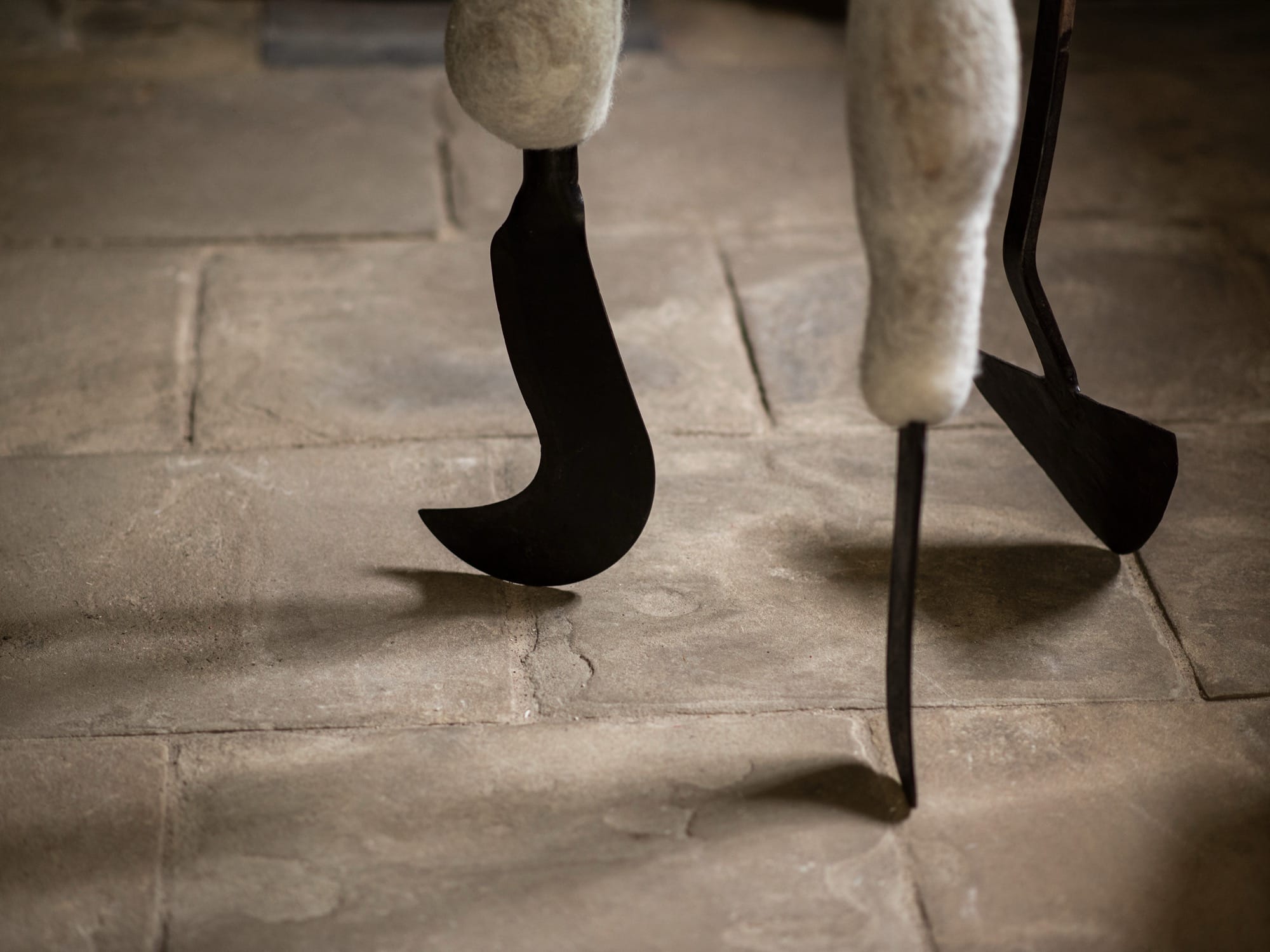 a detail of a large-scale textile installation by Nicola Turner with undulating, twisted details and metal blades for