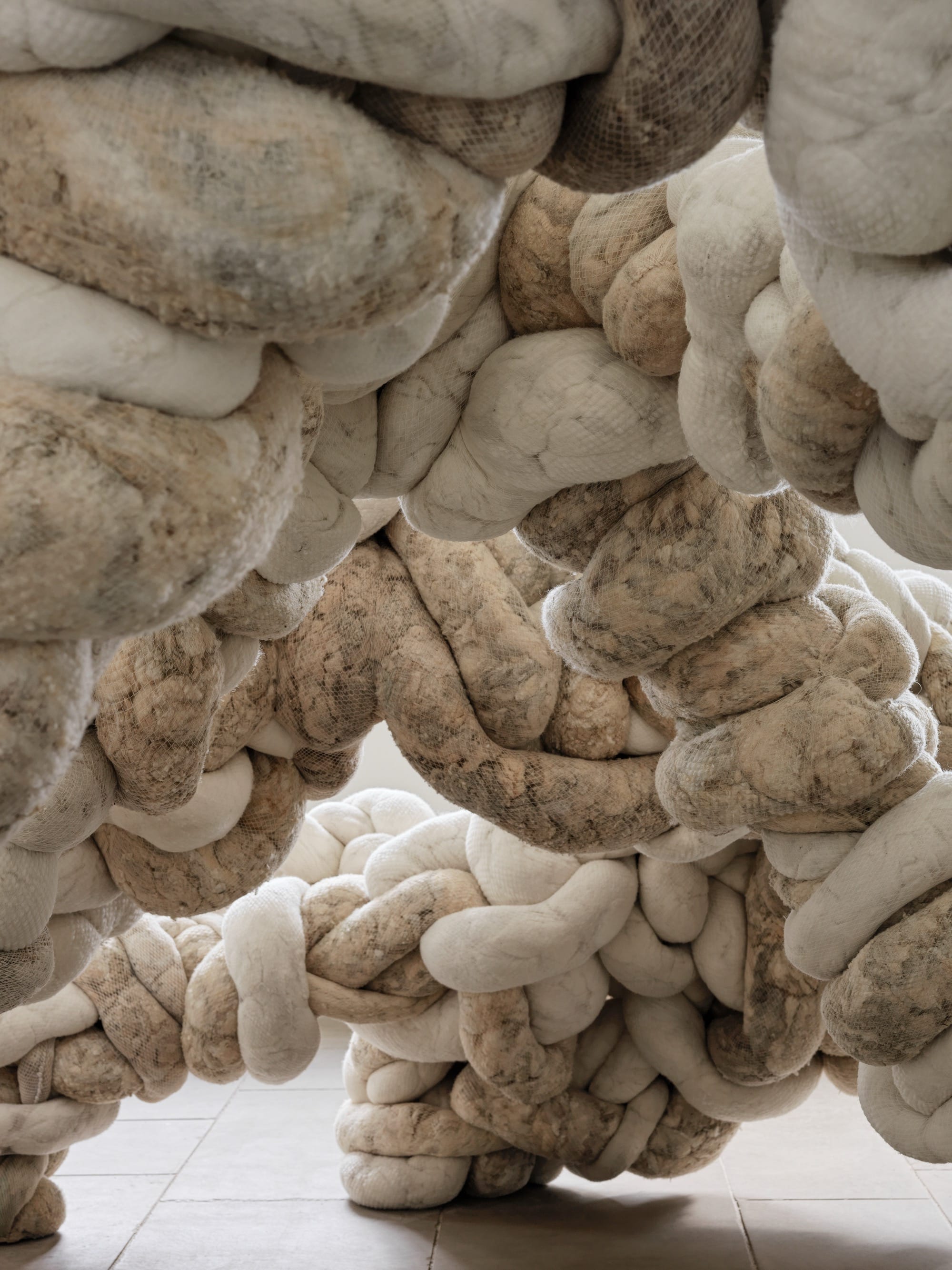 a detail of a large-scale textile installation by Nicola Turner with undulating, twisted details