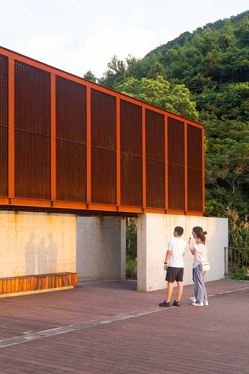 corten-clad twin pavilions frame shifting sea views along chinese coastal valley - 4