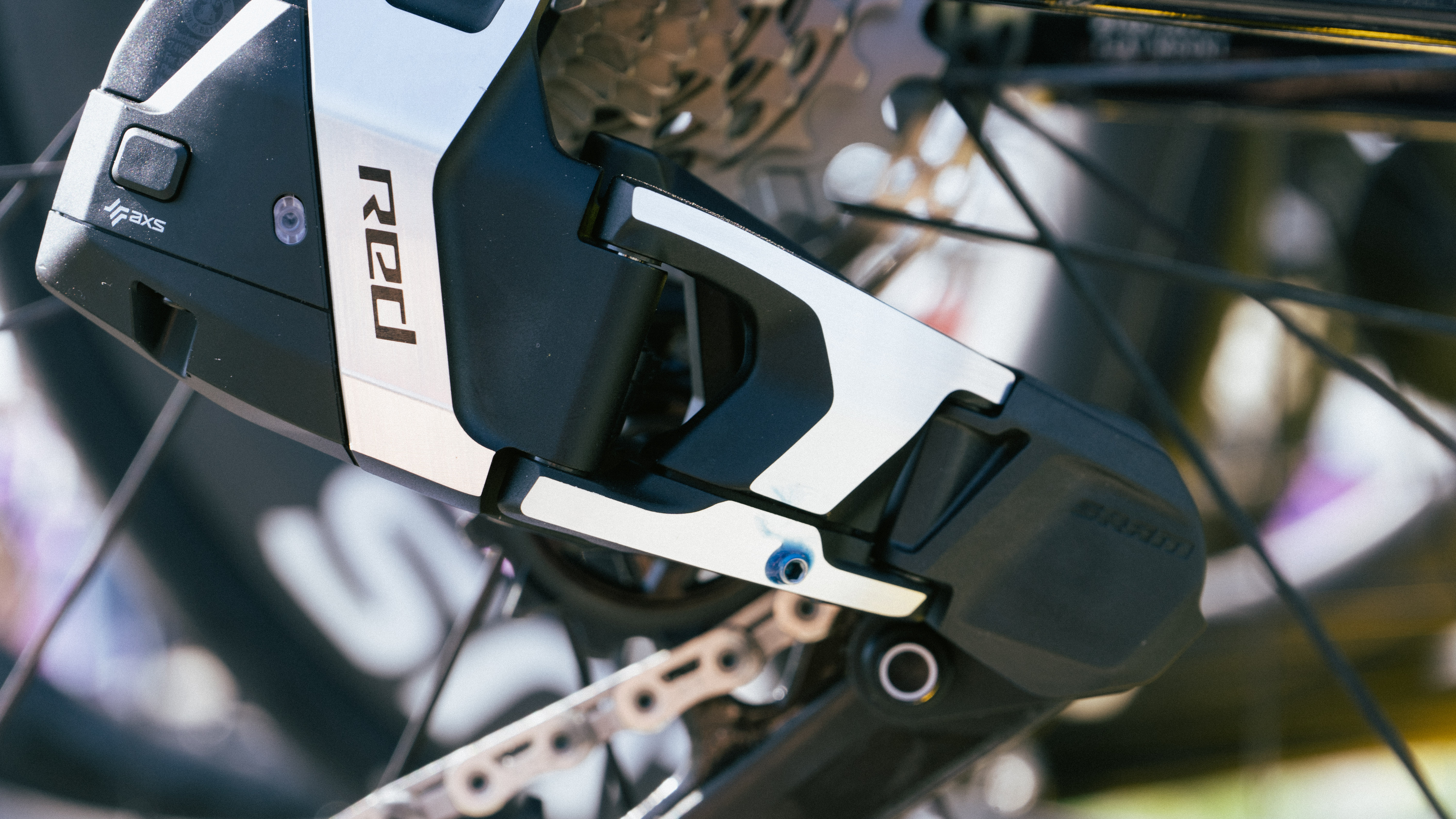A Lidl-Trek SRAM Red XPLR rear derailleur that has been modified by fitting a small grub screw to limit the gears