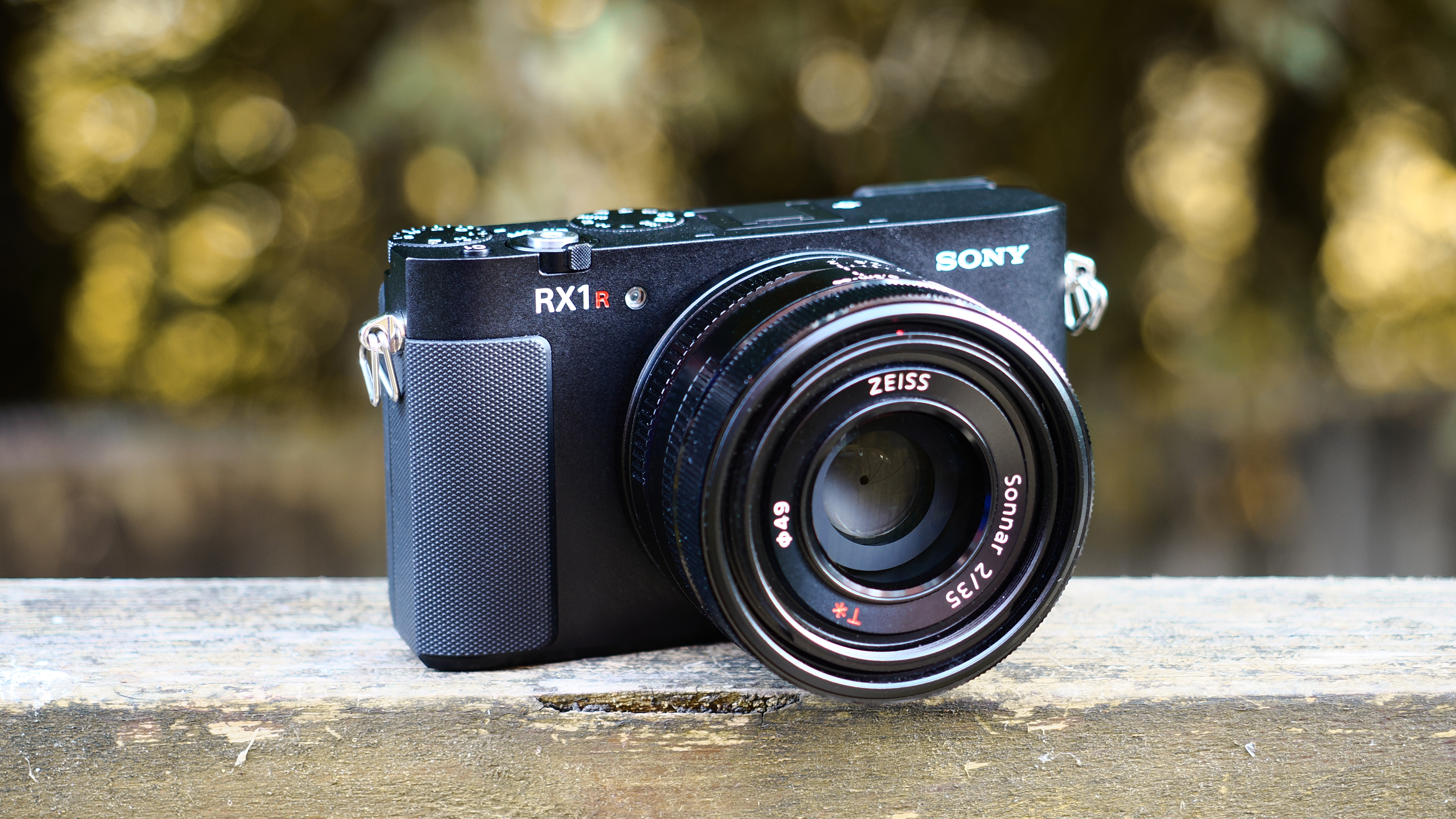 Sony RX1R III on a wooden surface in an outdoor environment