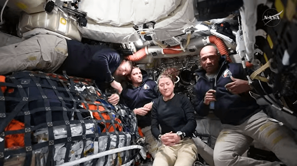Victor Glover and Artemis II crew on Orion capsule