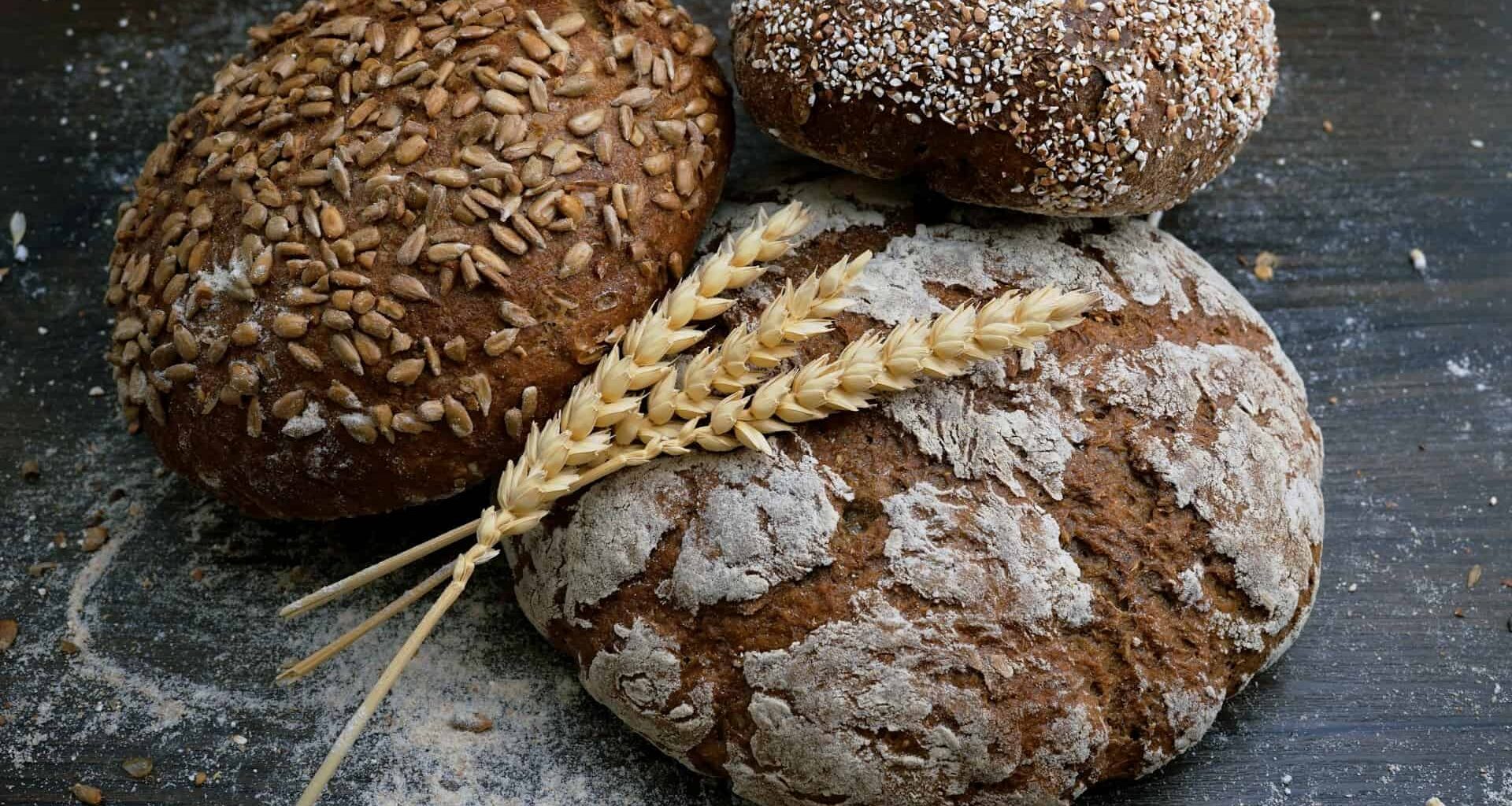 Artisanal bread with seeds and flour dust.