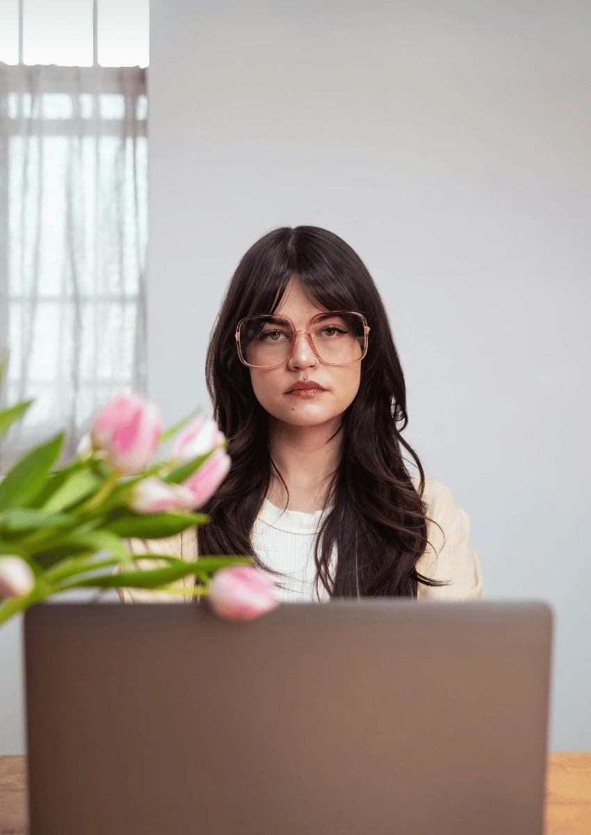woman staring at blank laptop intellectualizing emotions