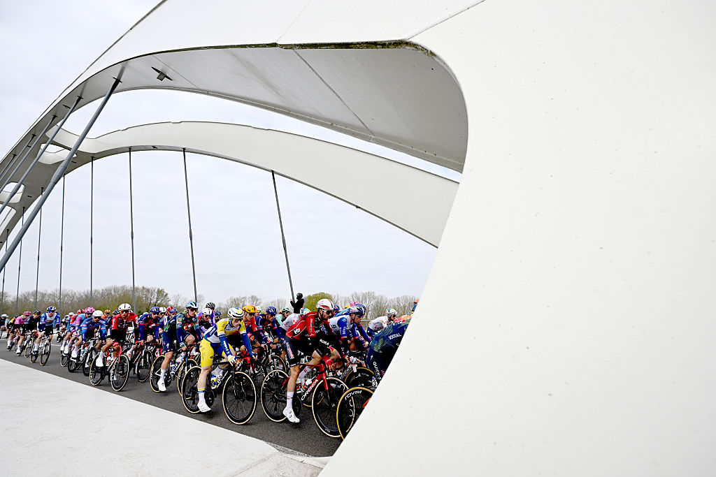 WAREGEM, BELGIUM - APRIL 01: and a general view of the peloton competing during the 80th Dwars Door Vlaanderen 2026 - Men&amp;apos;s Elite a 184.6km one day race from Roeselare to Waregem / #UCIWT / on April 01, 2026 in Waregem, Belgium. (Photo by Dario Belingheri/Getty Images)