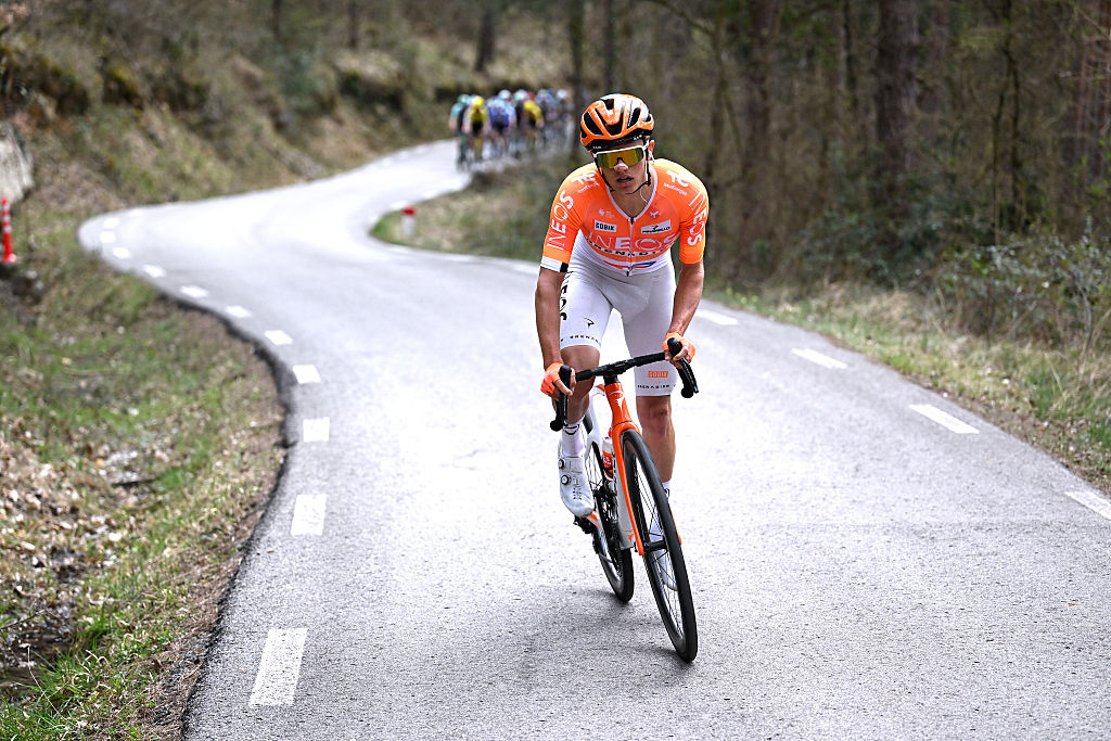 Front shot of Oscar Onley riding on his own in front of the peloton