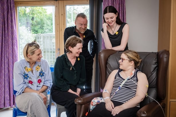 Undated handout photo courtesy of Brian Morrison of (L-R) actors Sian Brooke, Joanne Crawford, Richard Dormer and Katherine Devlin chatting with inpatient Nicola Loughins during their visit to the Marie Curie hospice in Belfast. Stars from the hit BBC police drama Blue Lights visited a Marie Curie H