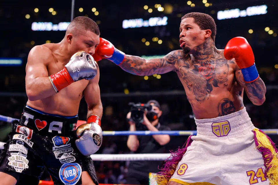 Gervonta Davis punching Isaac Cruz during their clash