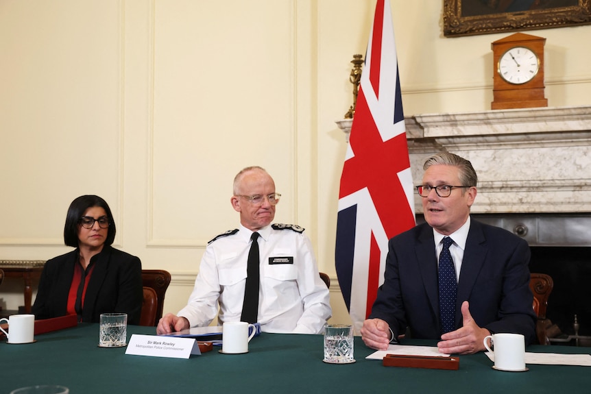 British Home Secretary Shabana Mahmood, Met Police Commissioner Mark Rowley, and British Prime Minister Keir Starmer sit.