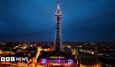 An illuminated Blackpool Tower with a sign highlighting Strictly 2026
