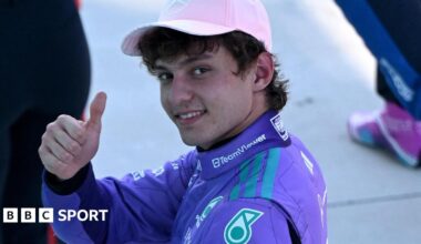 Mercedes' Kimi Antoenlli looks back, smiles and gives the thumbs-up signal after taking pole position for the Miami Grand Prix