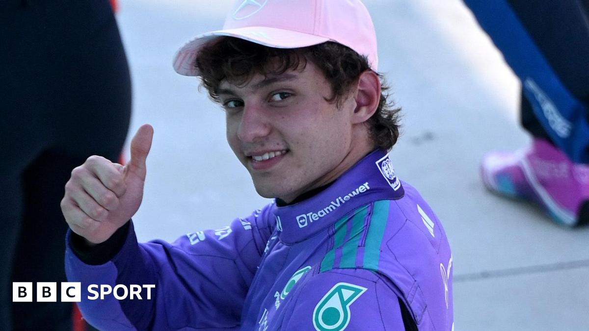 Mercedes' Kimi Antoenlli looks back, smiles and gives the thumbs-up signal after taking pole position for the Miami Grand Prix