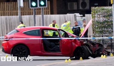 Man arrested after car hits group in town centre - BBC