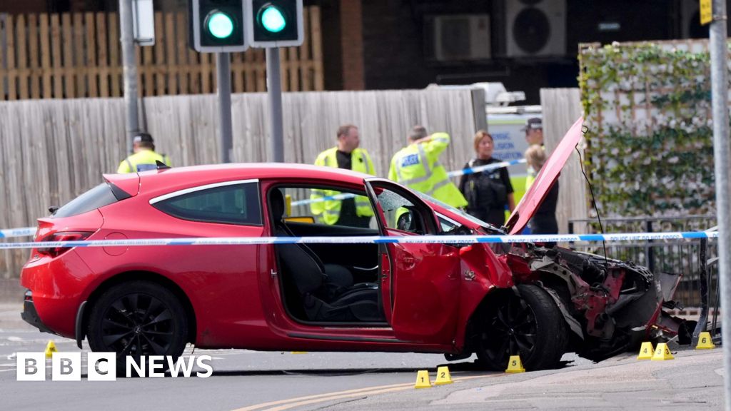 Man arrested after car hits group in town centre - BBC
