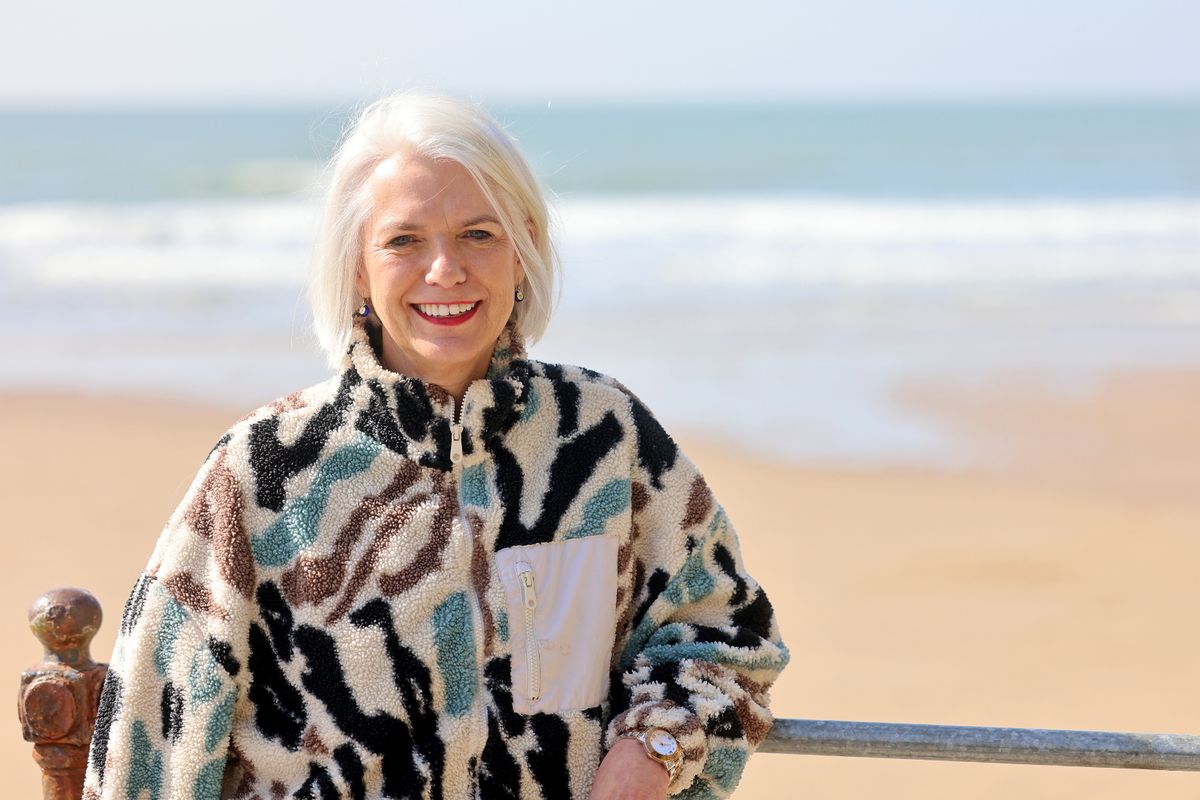 Woman pictured in front of abeach