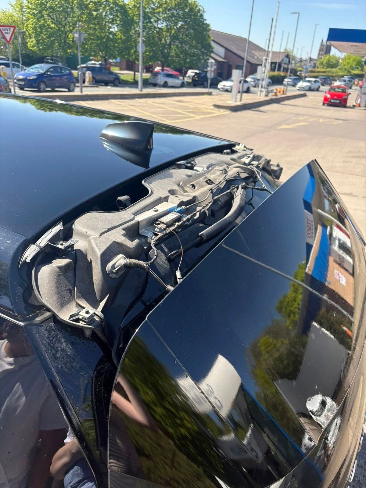 The roof was holed and electrics exposed when the top spoiler was torn off