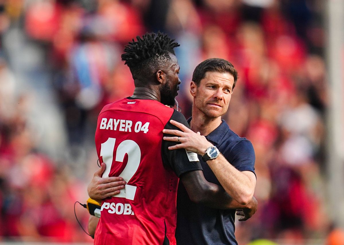 Xabi Alonso of Bayer 04 Leverkusen and Edmond Tapsoba of Bayer 04 Leverkusen looks on  during the 1.Bundesliga match between Bayer 04 Leverkusen and Borussia Dortmund at BayArena, Leverkusen, Germany on May 11, 2025.  (Photo by Ulrik Pedersen/NurPhoto via Getty Images)