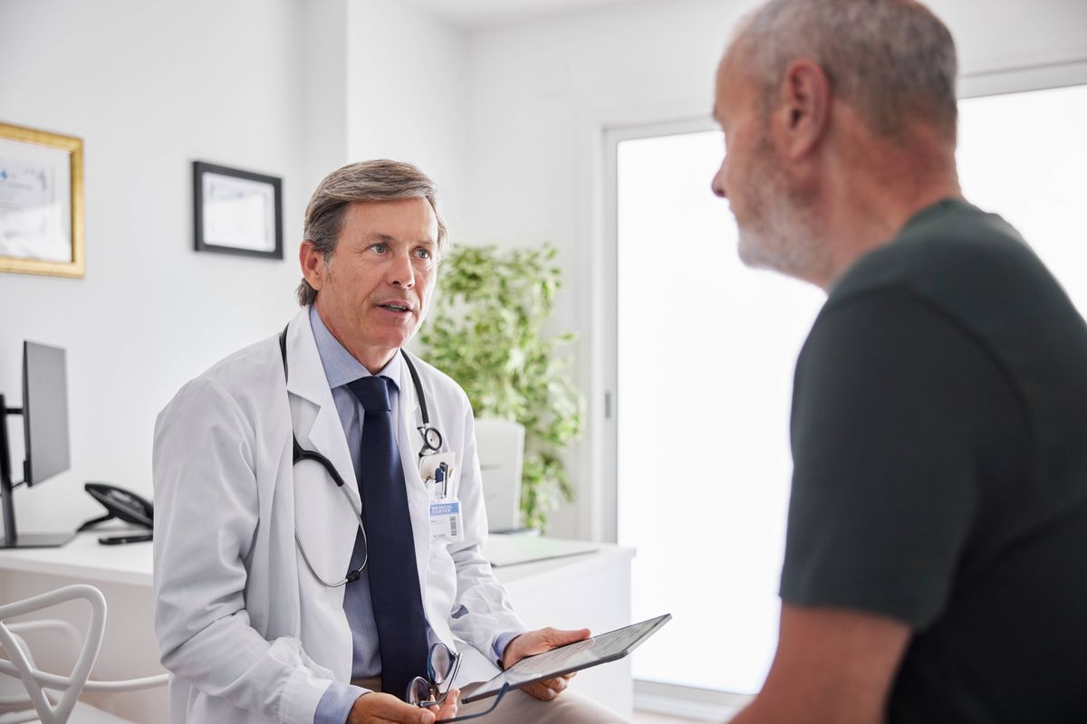 Doctor talking with patient, generic