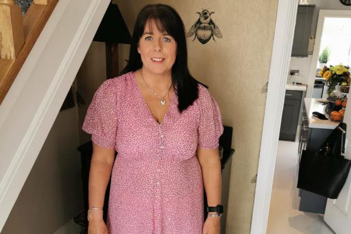 A woman in a pink dress