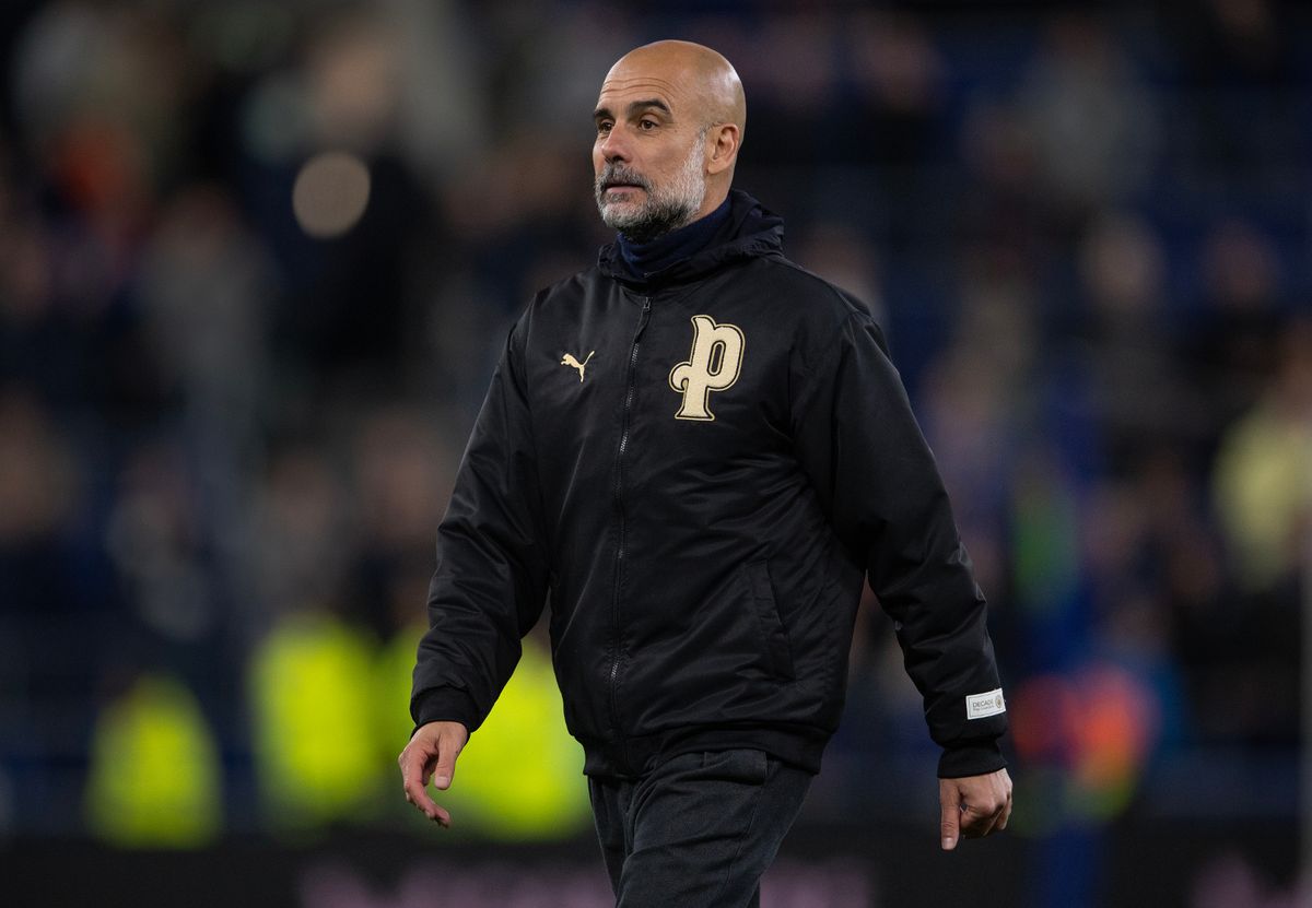Pep Guardiola of Manchester City looks on