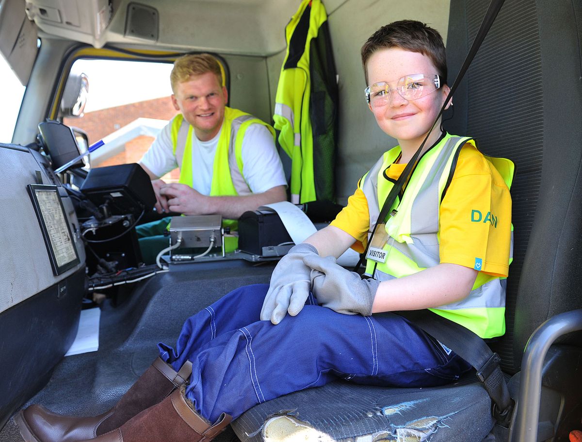 Six-year-old Daniel helps Refuse Technician Barry Woodward in 2014