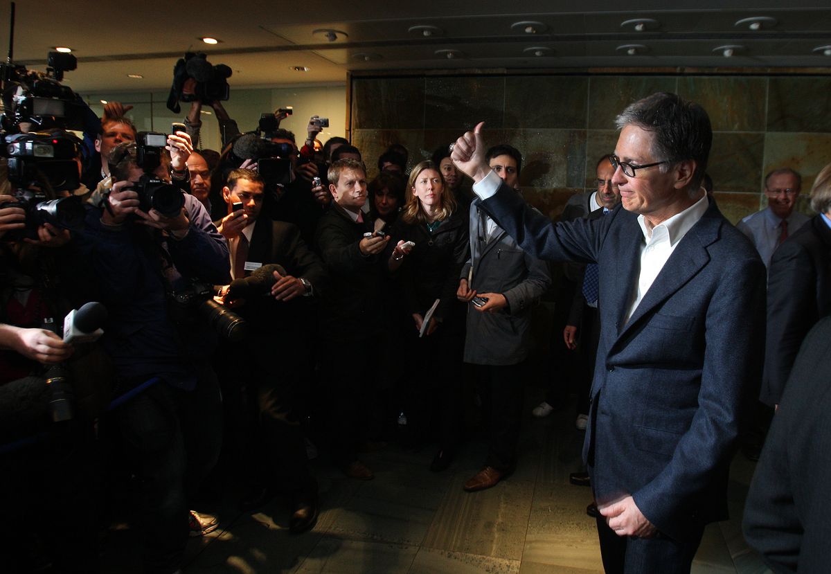 John Henry meets the press after purchasing Liverpool in October 2010
