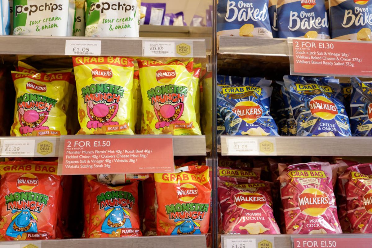 A price deal is seen advertising advertising packets of crisps in a shop in Birmingham, United Kingdom