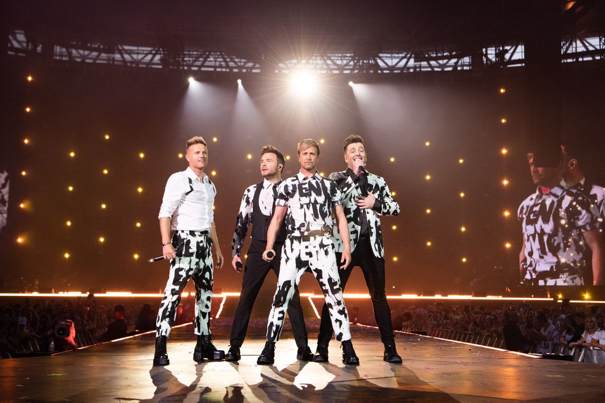 Nicky Byrne, Kian Egan, Markus Feehily and Shane Filan of Westlife Perform at Wembley Stadium on August 06, 2022 in London, England. (Photo by Joseph Okpako/WireImage )