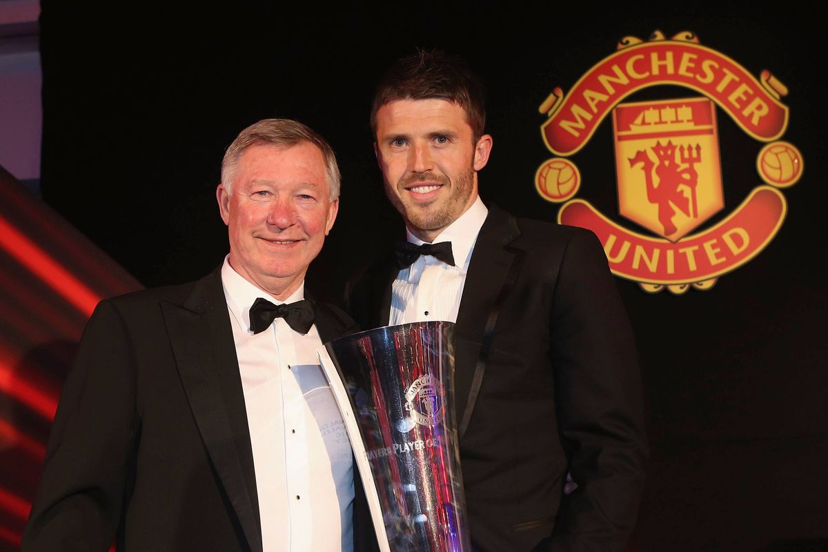 Michael Carrick of Manchester United is presented with the Players' Player of the Year by Sir Alex Ferguson at the club's annual Player of the Year awards ceremony at Old Trafford