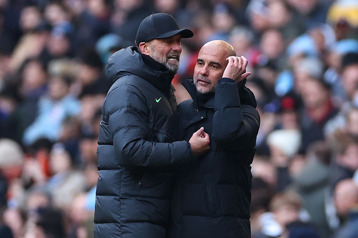 Jurgen Klopp and Pep Guardiola during a Liverpool vs Man City match at the Etihad