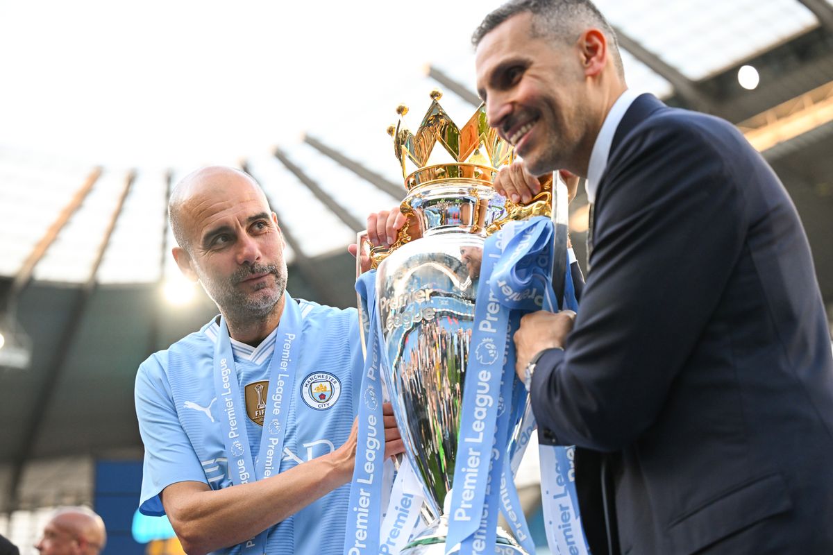 Pep Guardiola and Khaldoon Al Mubarak celebrate the last time Manchester City won the Premier League