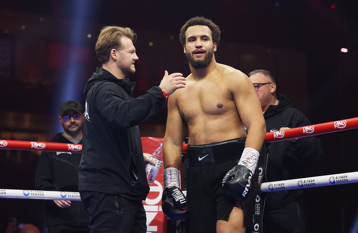 Moses Itauma celebrates victory with Head Trainer Ben Davison following the WBO Inter-Continental, WBA International and Commonwealth Silver Heavyweight titles' fight between Moses Itauma and Demsey McKean as part of Oleksandr Usyk v Tyson Fury 2, Reignited card at Kingdom Arena on December 21, 2024 in Riyadh, Saudi Arabia.