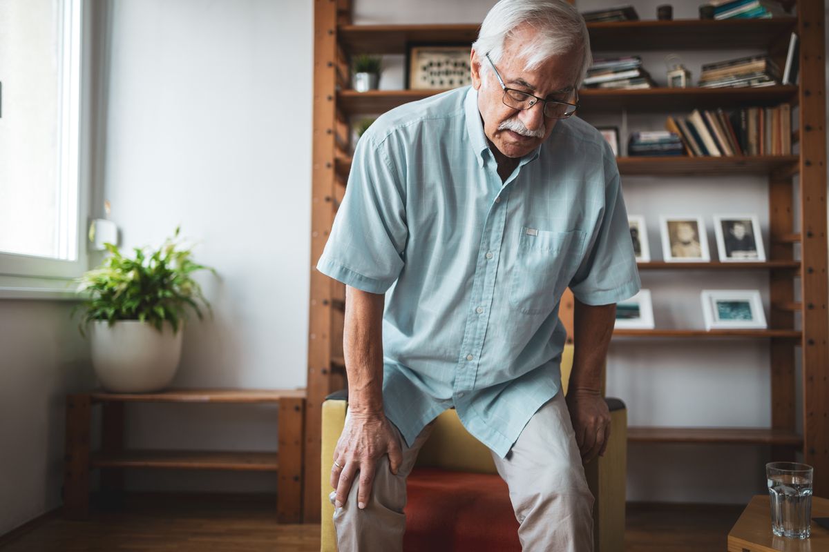 Man standing from chair