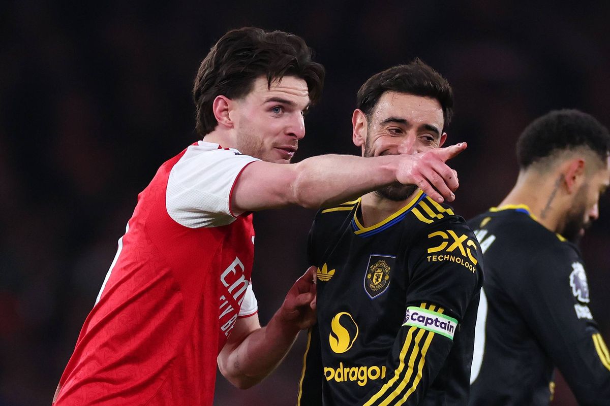Declan Rice of Arsenal with Bruno Fernandes of Manchester United during the Premier League match between Arsenal and Manchester United at Emirates Stadium on January 25, 2026 in London, England.