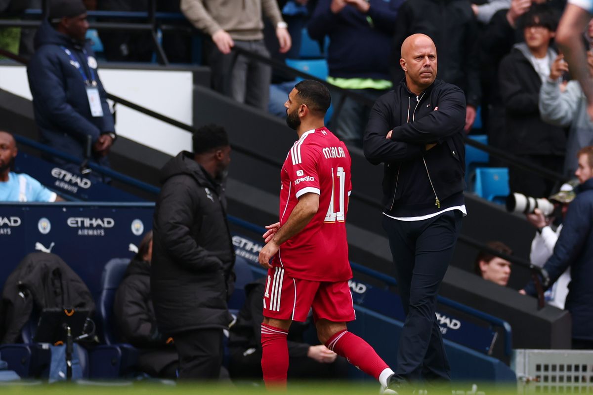 Mohamed Salah walks past Liverpool Manager Arne Slot during the Emirates FA Cup Quarter Final match between Manchester City and Liverpool on April 4, 2026 in Manchester, England