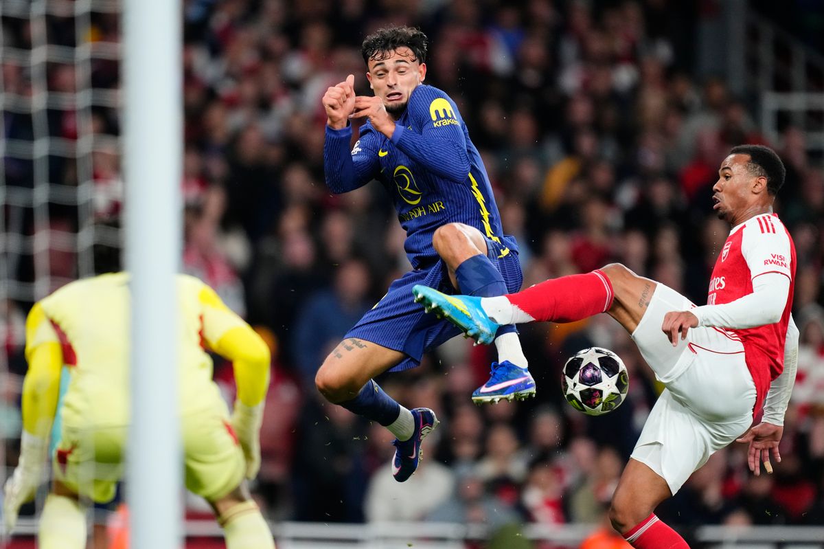Marc Pubill right-back of Atletico de Madrid and Spain and Gabriel centre-back of Arsenal and Brazil, compete for the ball during the UEFA Champions League 2025/26 Semi Final Second Leg match between Arsenal FC and Atletico de Madrid
