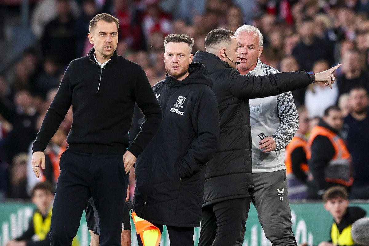 Referee Andy Madley has words with Kim Hellberg of Middlesbrough and Tonda Eckert of Southampton as tempers simmer during the semi-final