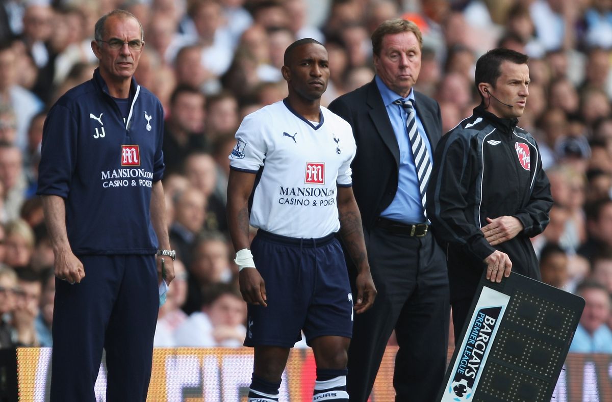 Jermain Defoe about to be substituted on for Tottenham as Harry Redknapp watches on