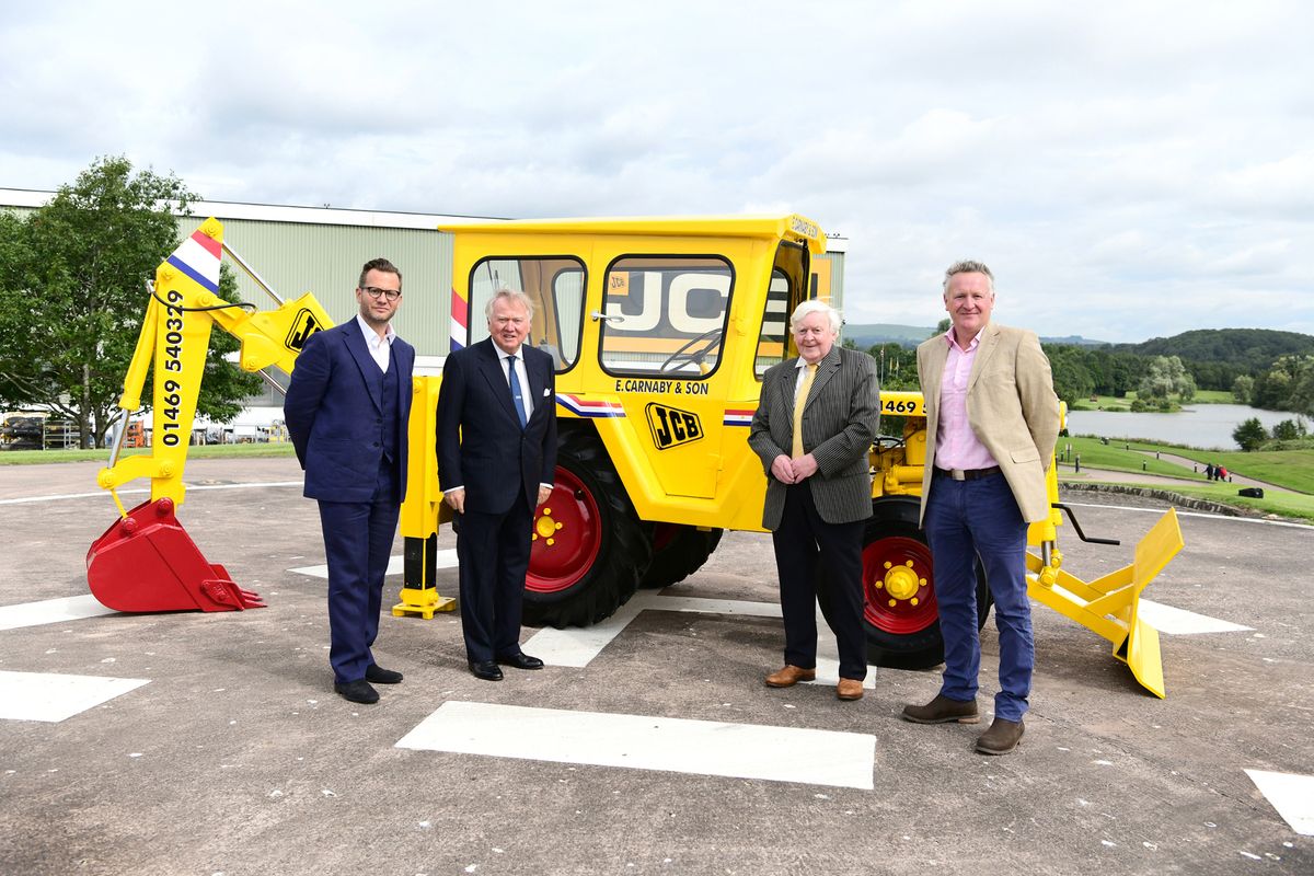 Lord Bamford pictured with his JCB heir George