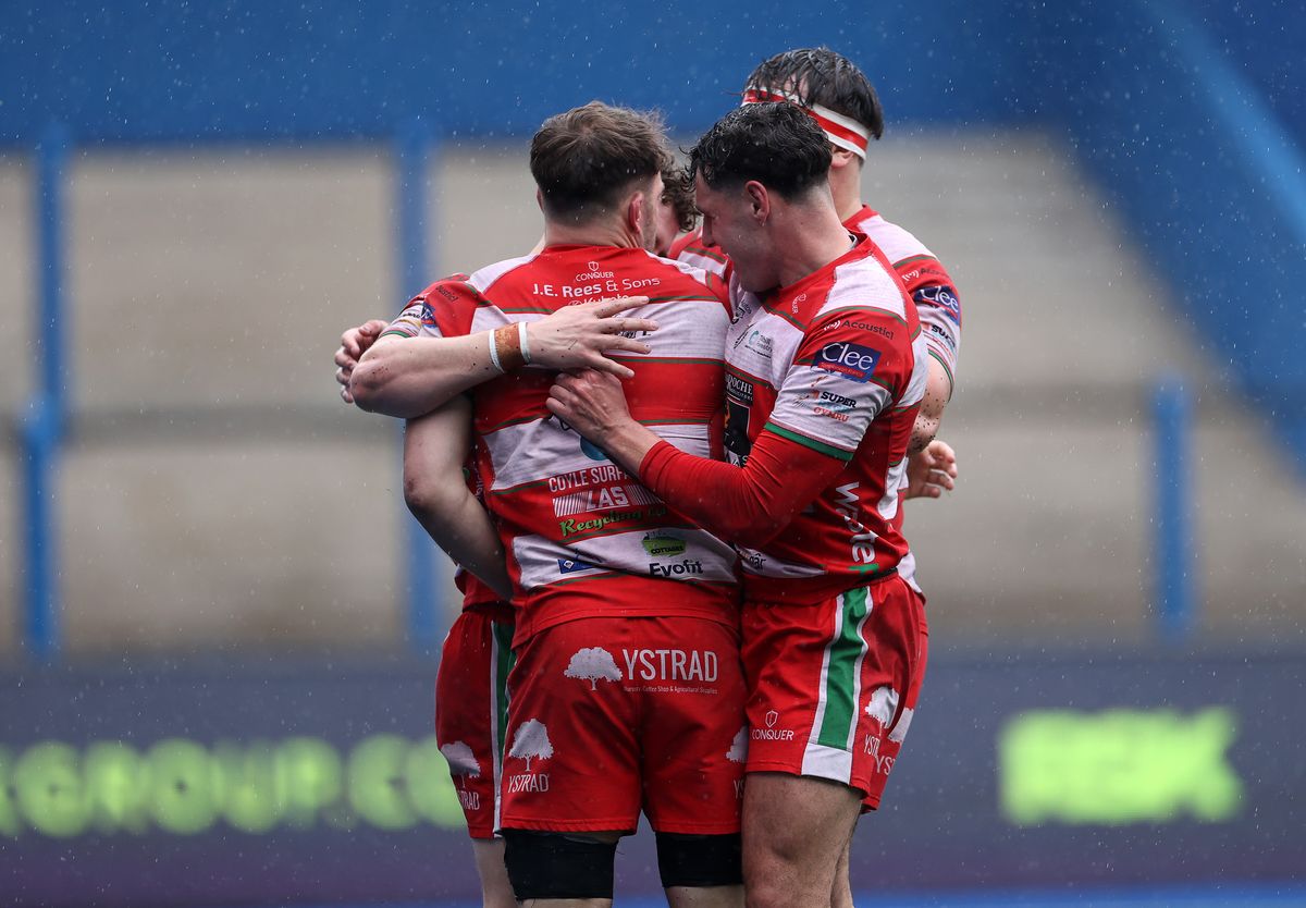 Kian Abraham of Llandovery celebrates scoring a try against Cardiff