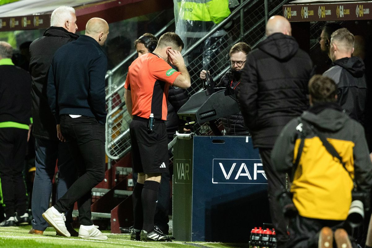 MOTHERWELL, SCOTLAND - MAY 13: Referee John Beaton checks the VAR monitor before awarding Celtic a penalty during a William Hill Premiership match between Motherwell and Celtic at Fir Park, on May 13, 2026, in Motherwell, Scotland. (Photo by Craig Foy / SNS Group)