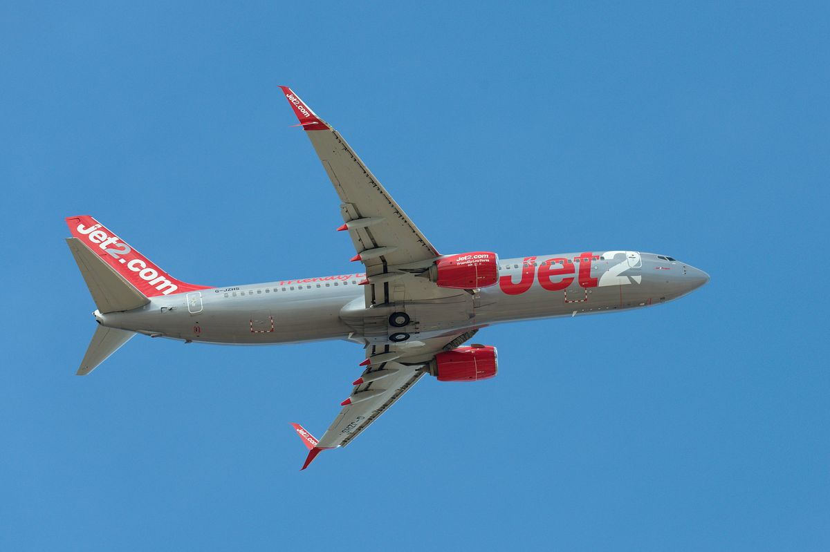 Boeing 737-8MG Jet2 Airlines flies in the blue sky. Takeoff at Tenerife Airport